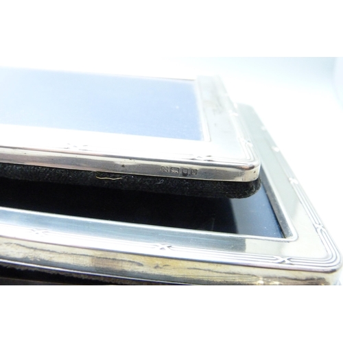 1075 - Three silver photograph frames, heights 15.5cm, 20.5cm and 21cm