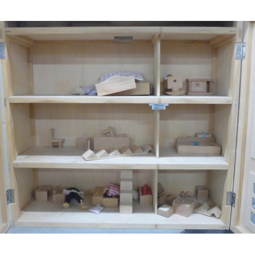 1107 - A three storey wooden dolls house with some furniture and accessories **PLEASE NOTE THIS LOT IS NOT ... 