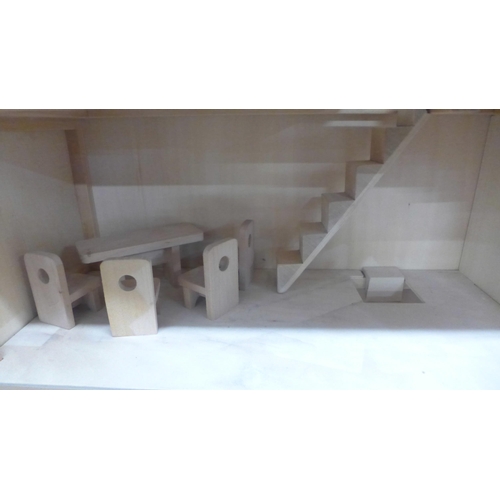 1107 - A three storey wooden dolls house with some furniture and accessories **PLEASE NOTE THIS LOT IS NOT ... 