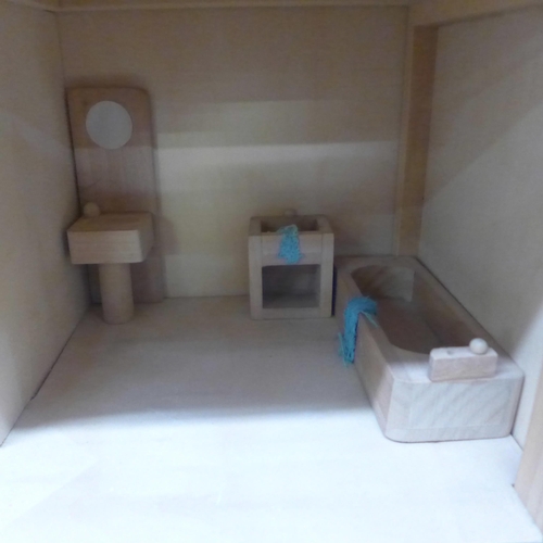 1107 - A three storey wooden dolls house with some furniture and accessories **PLEASE NOTE THIS LOT IS NOT ... 