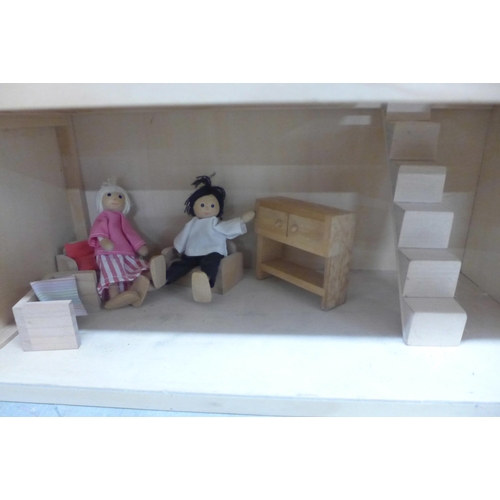 1107 - A three storey wooden dolls house with some furniture and accessories **PLEASE NOTE THIS LOT IS NOT ... 