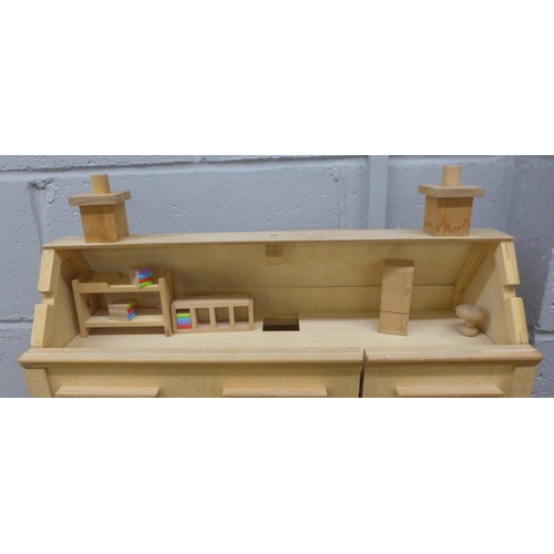 1107 - A three storey wooden dolls house with some furniture and accessories **PLEASE NOTE THIS LOT IS NOT ... 