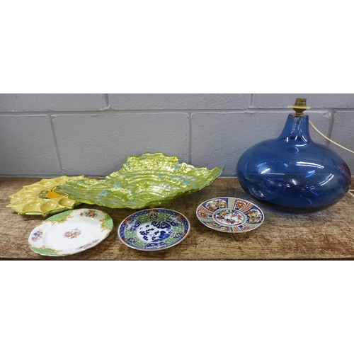 1108 - Glass paperweights including one Murano, a blue glass table lamp base, a glass dish, plates, etc **P... 