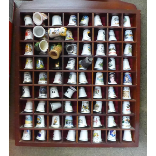 1125 - 519 thimbles in a display case, mainly ceramic **PLEASE NOTE THIS LOT IS NOT ELIGIBLE FOR IN-HOUSE P... 