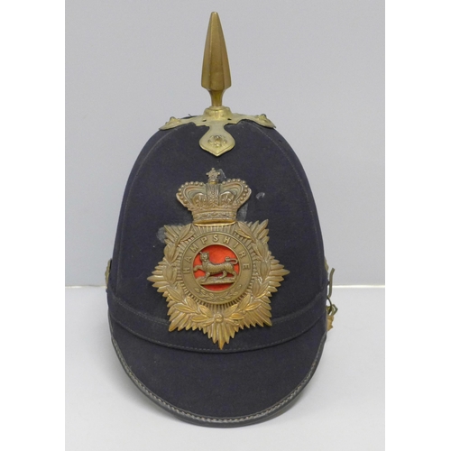 602 - A Hampshire regiment blue cloth helmet, issue mark 1911