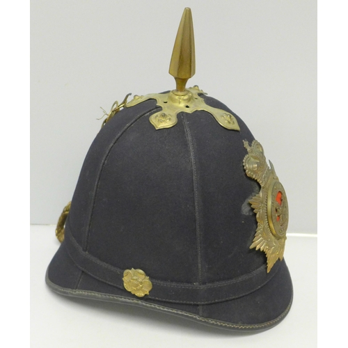 602 - A Hampshire regiment blue cloth helmet, issue mark 1911