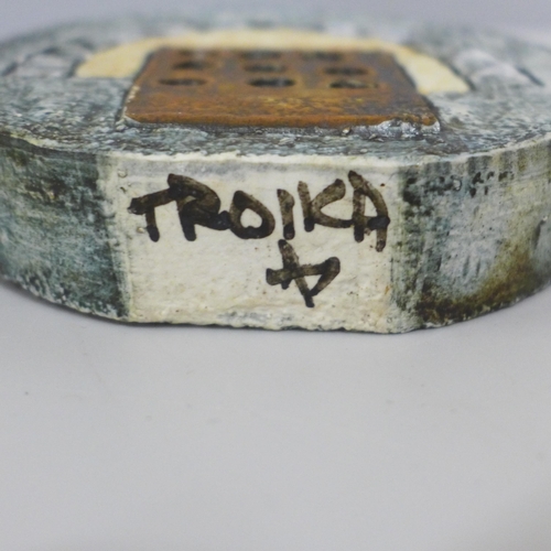 606 - A circular Troika vase, signed, 11.5cm