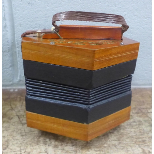 612 - A cased concertina squeezebox