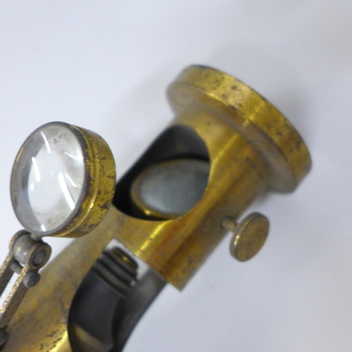 613 - A 19th Century gilt brass magnifier, 15.5cm