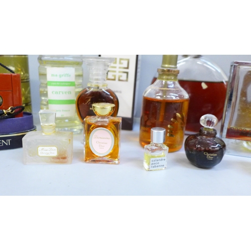 683 - A collection of vintage perfumes, including Opium and Givenchy, Chanel box, some incomplete