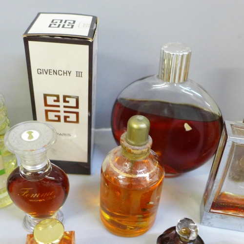 683 - A collection of vintage perfumes, including Opium and Givenchy, Chanel box, some incomplete