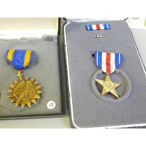 684 - Two US medals, Silver Star with ribbon and lapel pin, Air Medal, both cased, other badges, postcards... 