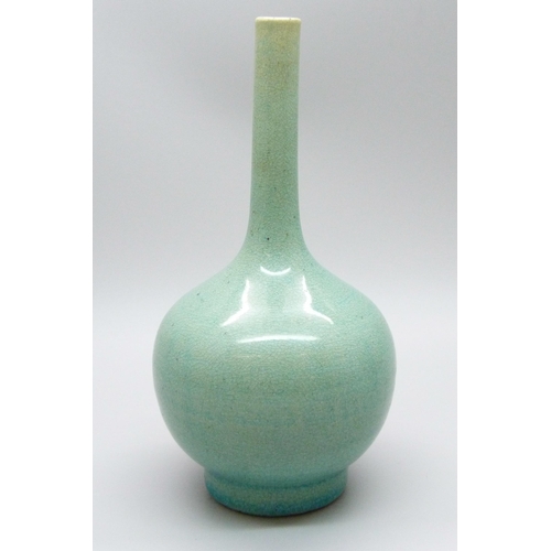 685 - An early 20th Century Japanese celadon glazed bottle shaped porcelain vase, chip to base, 12.5cms h