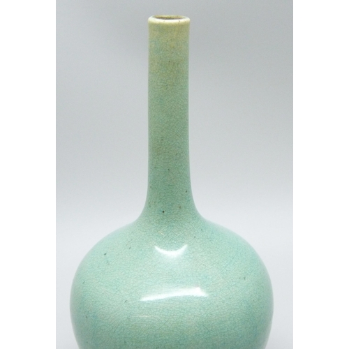 685 - An early 20th Century Japanese celadon glazed bottle shaped porcelain vase, chip to base, 12.5cms h