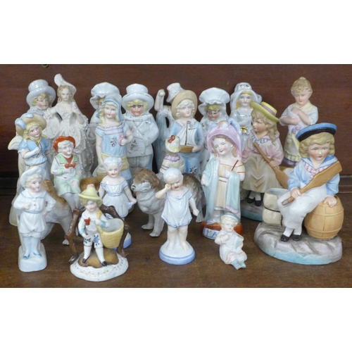 689 - A large collection of English and Continental porcelain and bisque figures, including three children... 