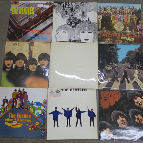 692 - Eleven The Beatles LP records and one Wings; Please Please Me, Yellow Submarine, Revolver, Abbey Roa... 