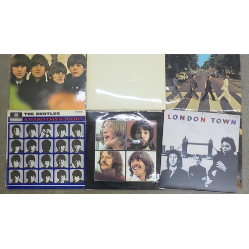 692 - Eleven The Beatles LP records and one Wings; Please Please Me, Yellow Submarine, Revolver, Abbey Roa... 