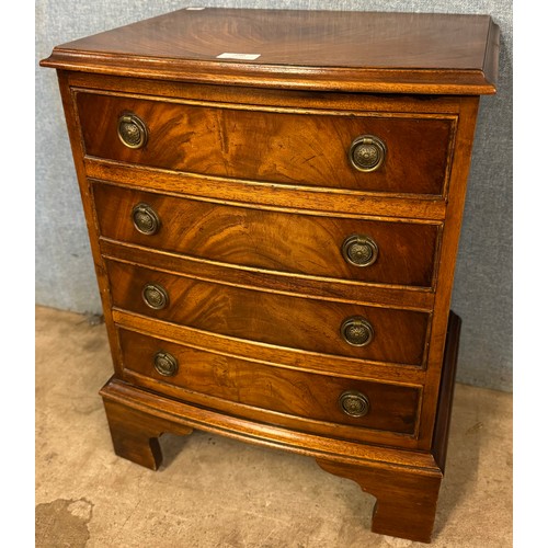 296 - A small George III style mahogany bow front chest of drawers