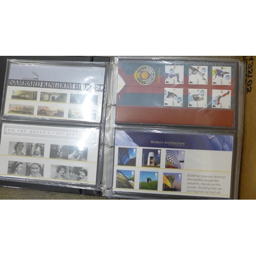 699 - Great Britain 2001-2010 commemorative presentation pack in a box and one album. 140+ packs with all ... 