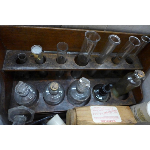 704 - A collection of medical items including a wooden test tube rack, poison jars, instruments, etc.