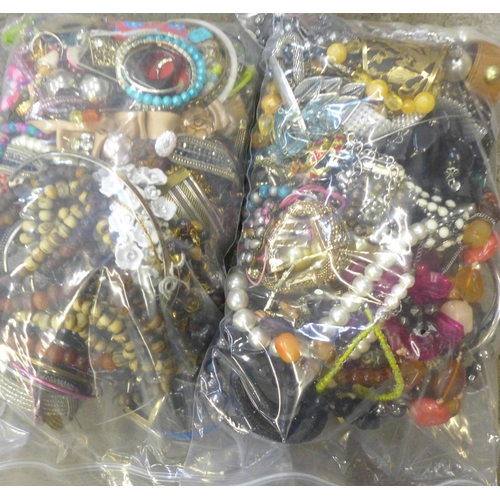 711 - Two bags of costume jewellery