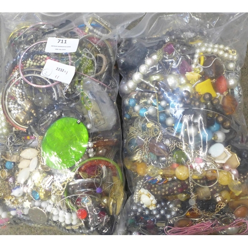 711 - Two bags of costume jewellery