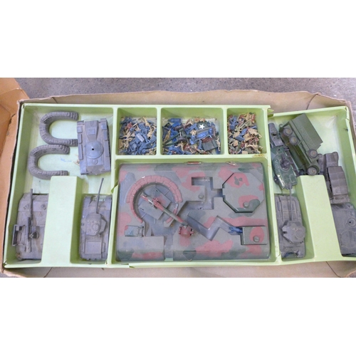 714 - A collection of tin plate toys including Chad Valley, boxed and an Airfix gun emplacement assault se... 