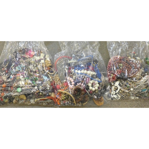 718 - Three large bags of costume jewellery