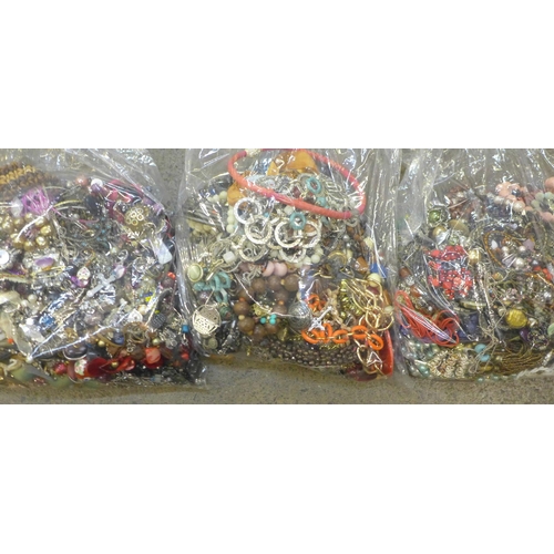 718 - Three large bags of costume jewellery