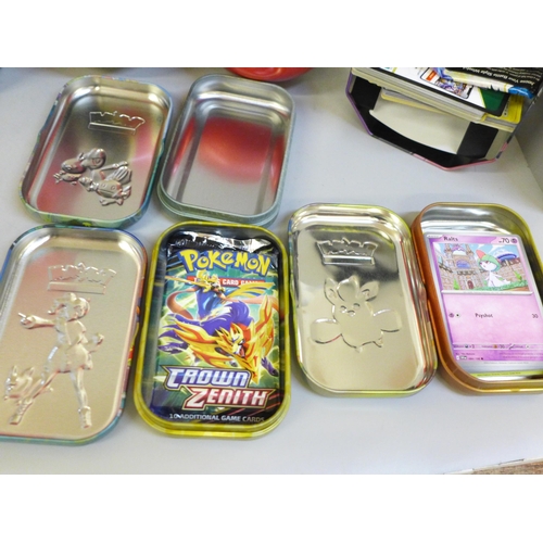 741 - A Pokemon Elite Trainer box, eight mini tins and a large tin, some containing cards and two Pokeball... 