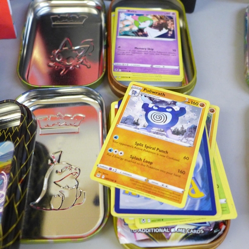 741 - A Pokemon Elite Trainer box, eight mini tins and a large tin, some containing cards and two Pokeball... 