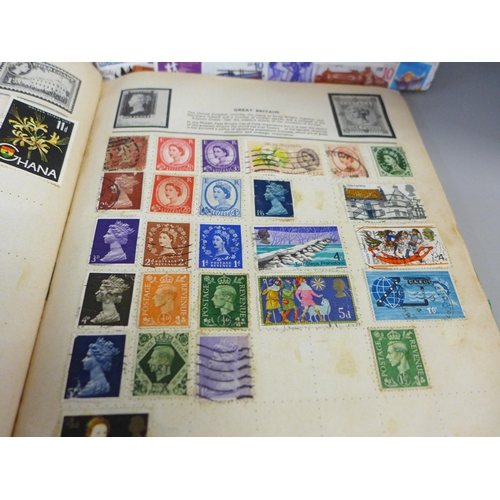 755 - Three stamp albums and a folder of loose stamps