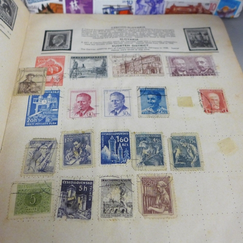 755 - Three stamp albums and a folder of loose stamps