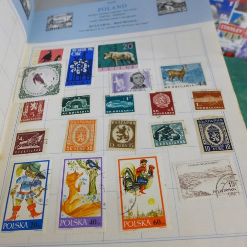 755 - Three stamp albums and a folder of loose stamps