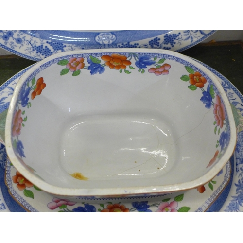 757 - Two blue and white ceramic serving plates and an ironstone china soup tureen with lid and stand, a/f... 