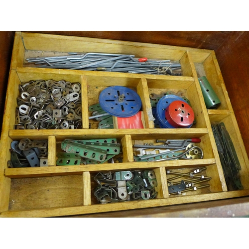 759 - A collection of vintage Meccano in a cabinet