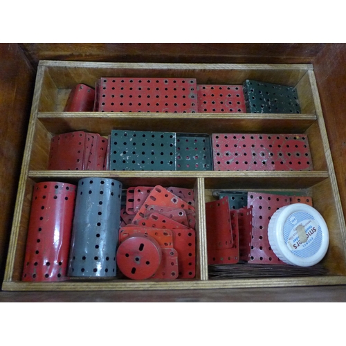 759 - A collection of vintage Meccano in a cabinet