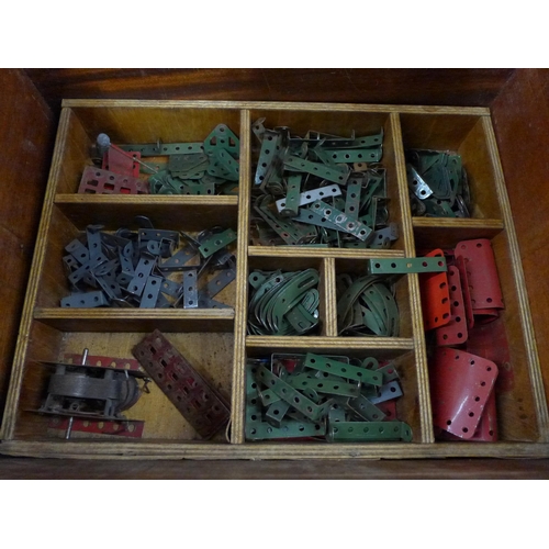 759 - A collection of vintage Meccano in a cabinet