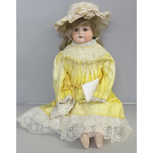 762 - A German Armand Marseille bisque head doll, brown sleep eyes, 370 stamp, 51cm