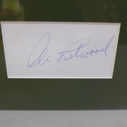 766 - A Clint Eastwood autographed display, (no COA)