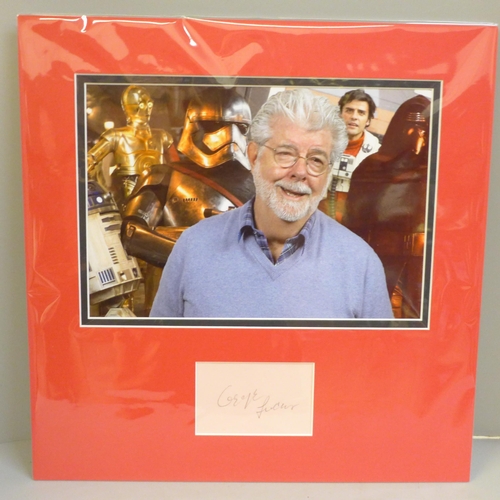 777 - A George Lucas (Star Wars) autographed display, (no COA)