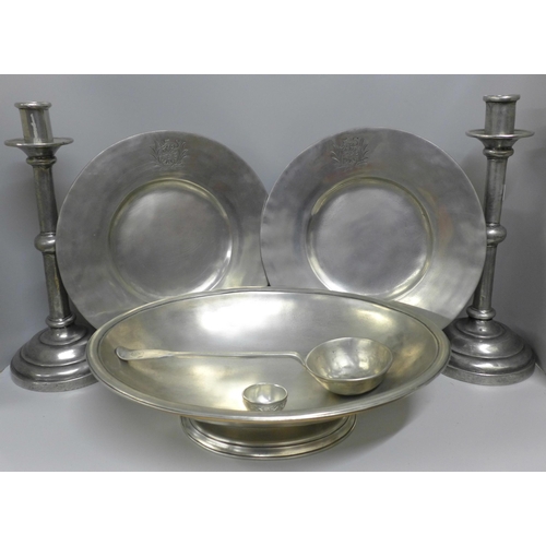 786 - A collection of pewter including a pair of large candlesticks, a shallow bowl and a pair of plates