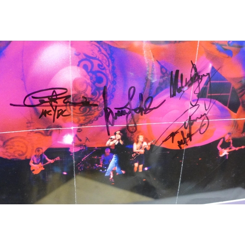 790 - An AC/DC autographed CD poster display, (no COA)