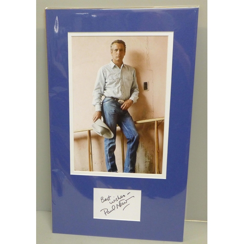 793 - A Paul Newman autographed display, (no COA)