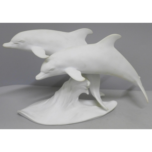 799 - A Kaiser Germany matt white dolphin figure group, boxed