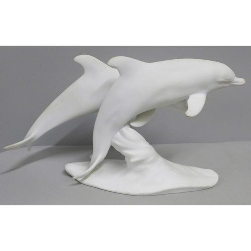 799 - A Kaiser Germany matt white dolphin figure group, boxed