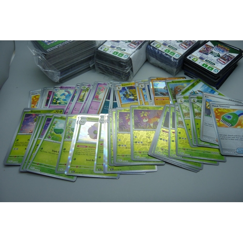 820 - Fifty holographic Pokemon cards and Pokemon code cards