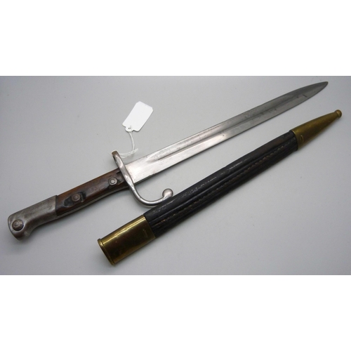 823 - A German bayonet, the blade marked Weyersberg Kirschbaum & Cie., Solingen, with scabbard