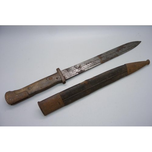 824 - A German bayonet, the blade marked Weyersberg Kirschbaum & Cie, Solingen and Erfurt, with scabbard, ... 