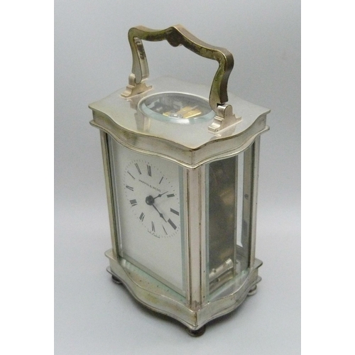 837 - A Mappin & Webb carriage clock with key